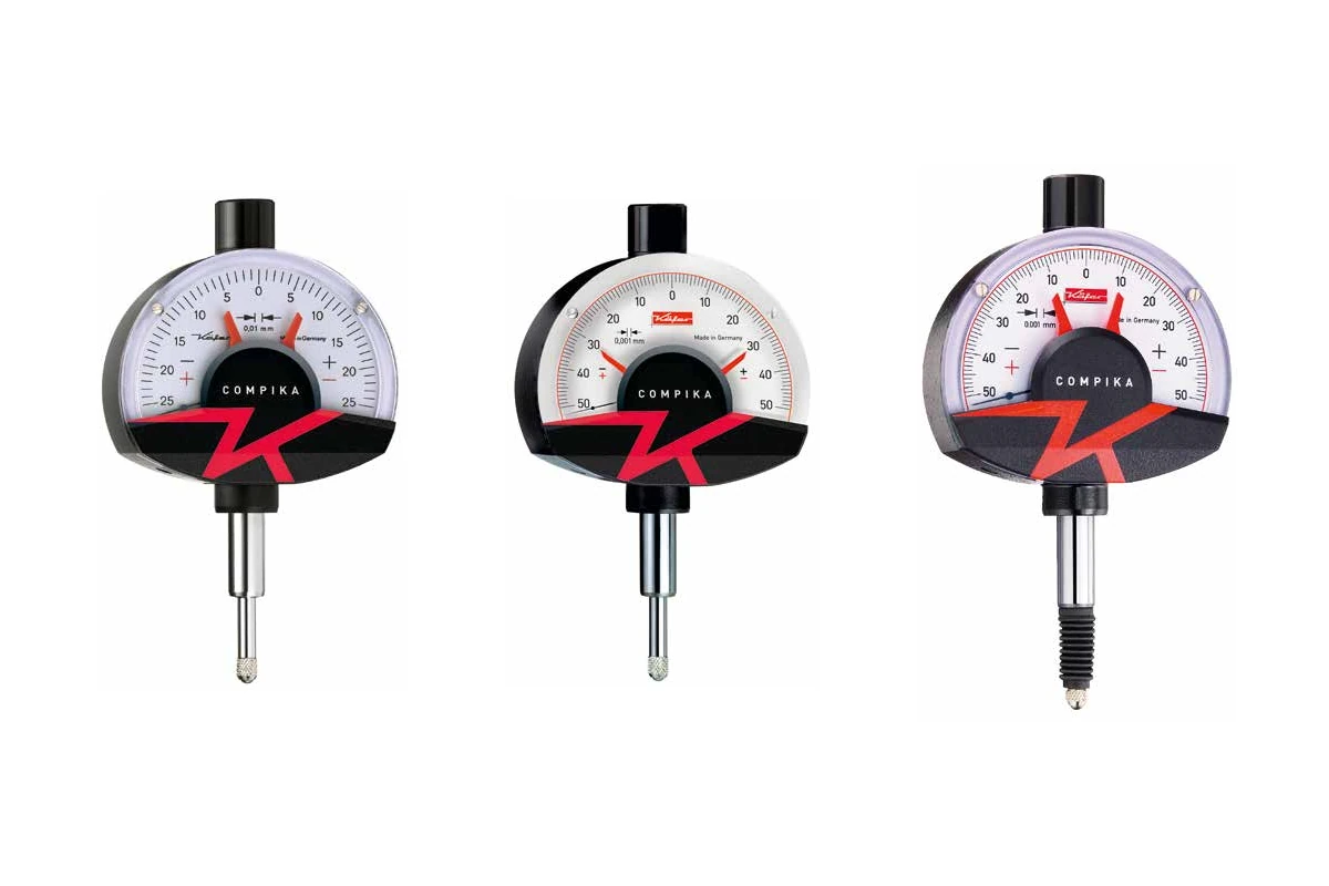 Comparators with free lift and shock protection